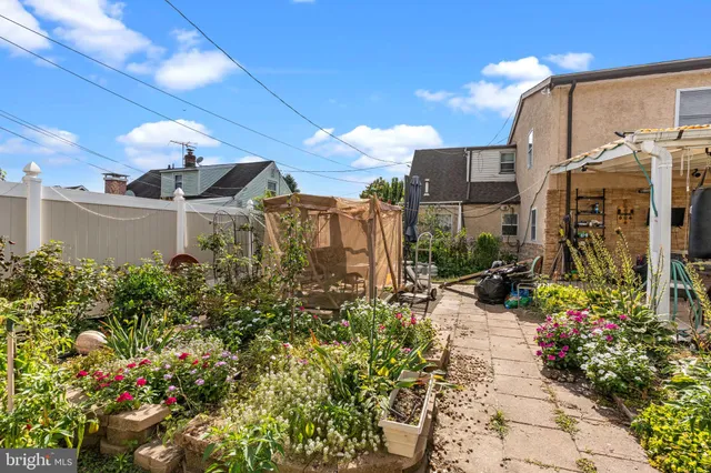 a view of a backyard with sitting area