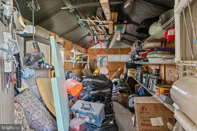 a view of a house with backyard sitting area and garden