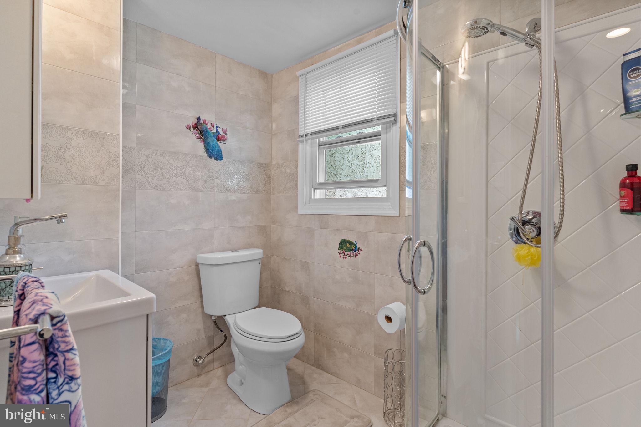 813 Piermont Street Philadelphia, PA 19116 - Photo 6 of 37 a white toilet sitting next to a bathroom sink