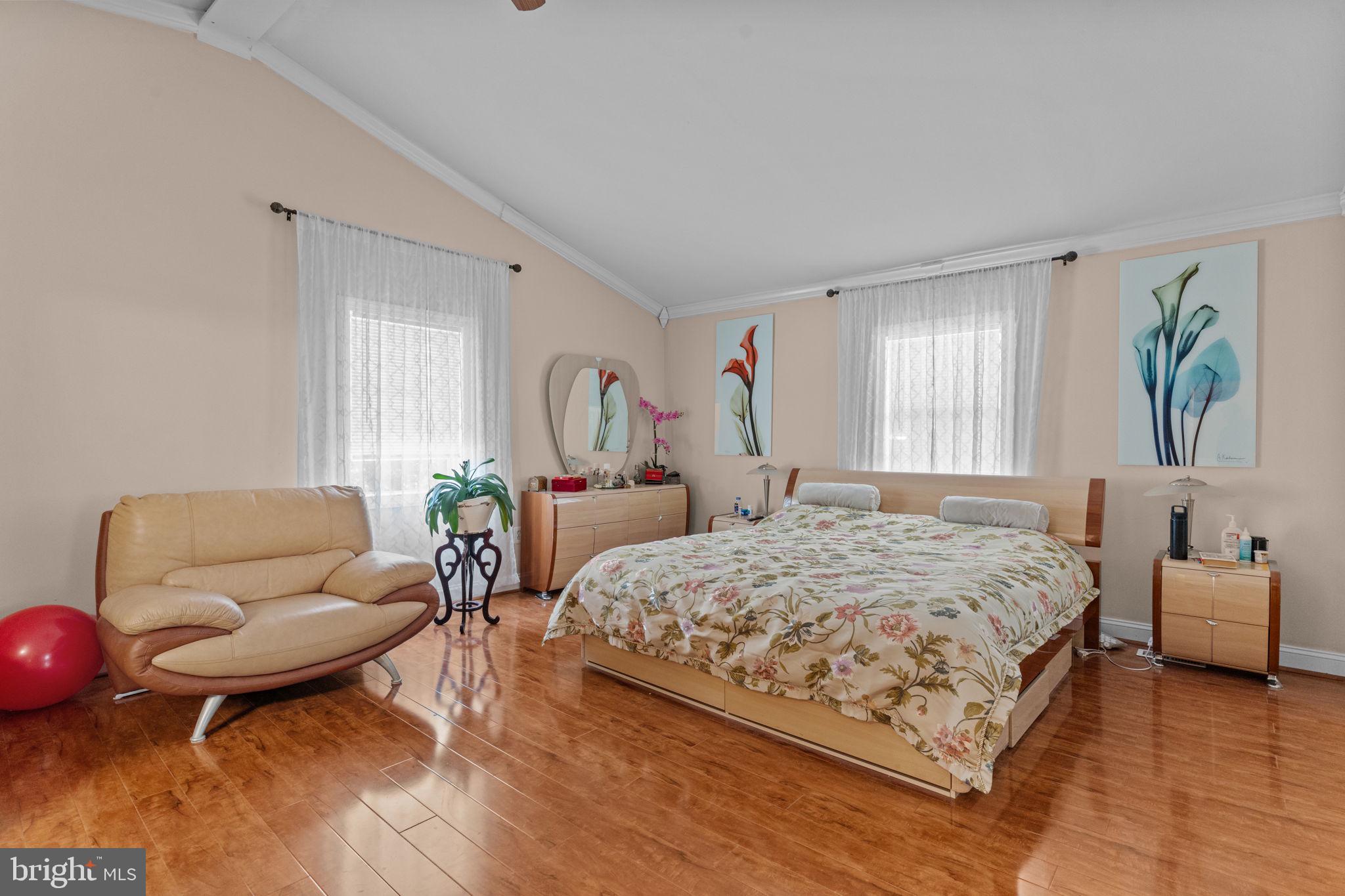 813 Piermont Street Philadelphia, PA 19116 - Photo 7 of 37 a bedroom with a bed couches chair and a large window