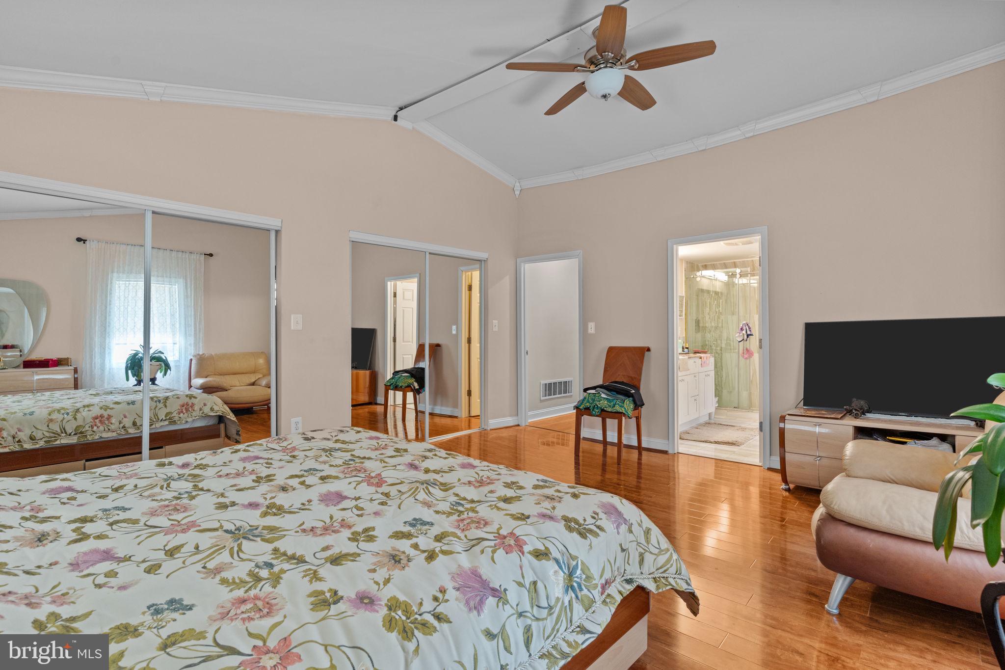 813 Piermont Street Philadelphia, PA 19116 - Photo 8 of 37 a bedroom with a bed and wooden floor