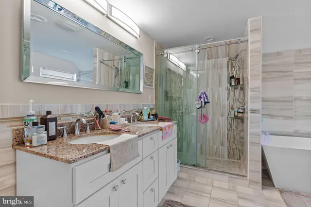 a bathroom with a tub and sink