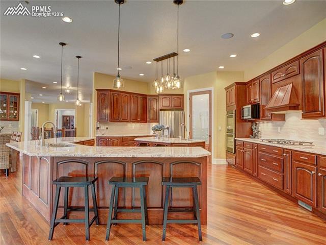 15925 Winding Trail Road Colorado Springs, CO 80908 - Photo 13 of 36 Kitchen Overview with Walk-In Pantry