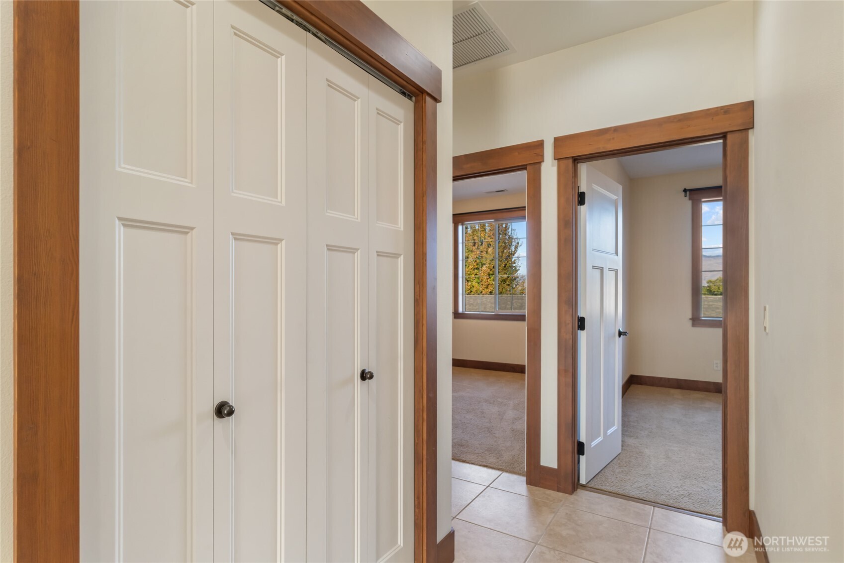 1051 North Baker Avenue, Unit B203 East Wenatchee, WA 98802 - Photo 22 of 33 a view of a hallway with a wooden door