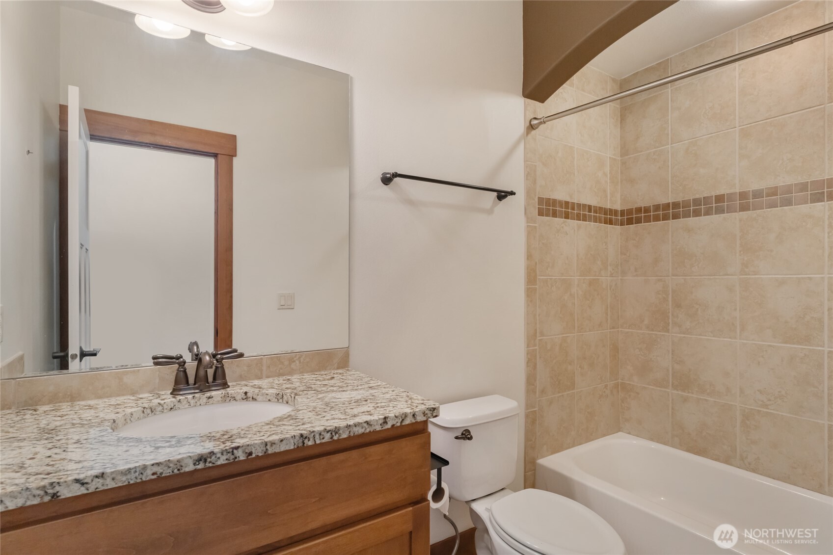1051 North Baker Avenue, Unit B203 East Wenatchee, WA 98802 - Photo 25 of 33 a bathroom with a granite countertop sink toilet and shower