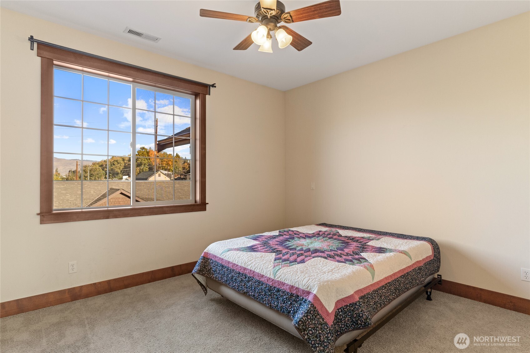 1051 North Baker Avenue, Unit B203 East Wenatchee, WA 98802 - Photo 27 of 33 a bedroom with a bed and window