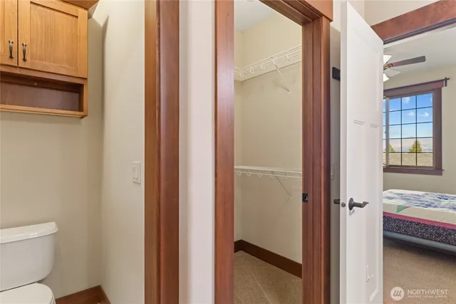 a bathroom with a granite countertop shower and a sink