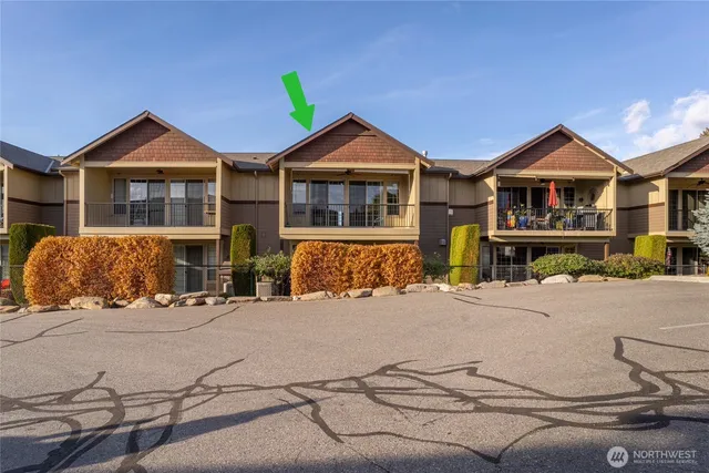 a front view of a house with garage