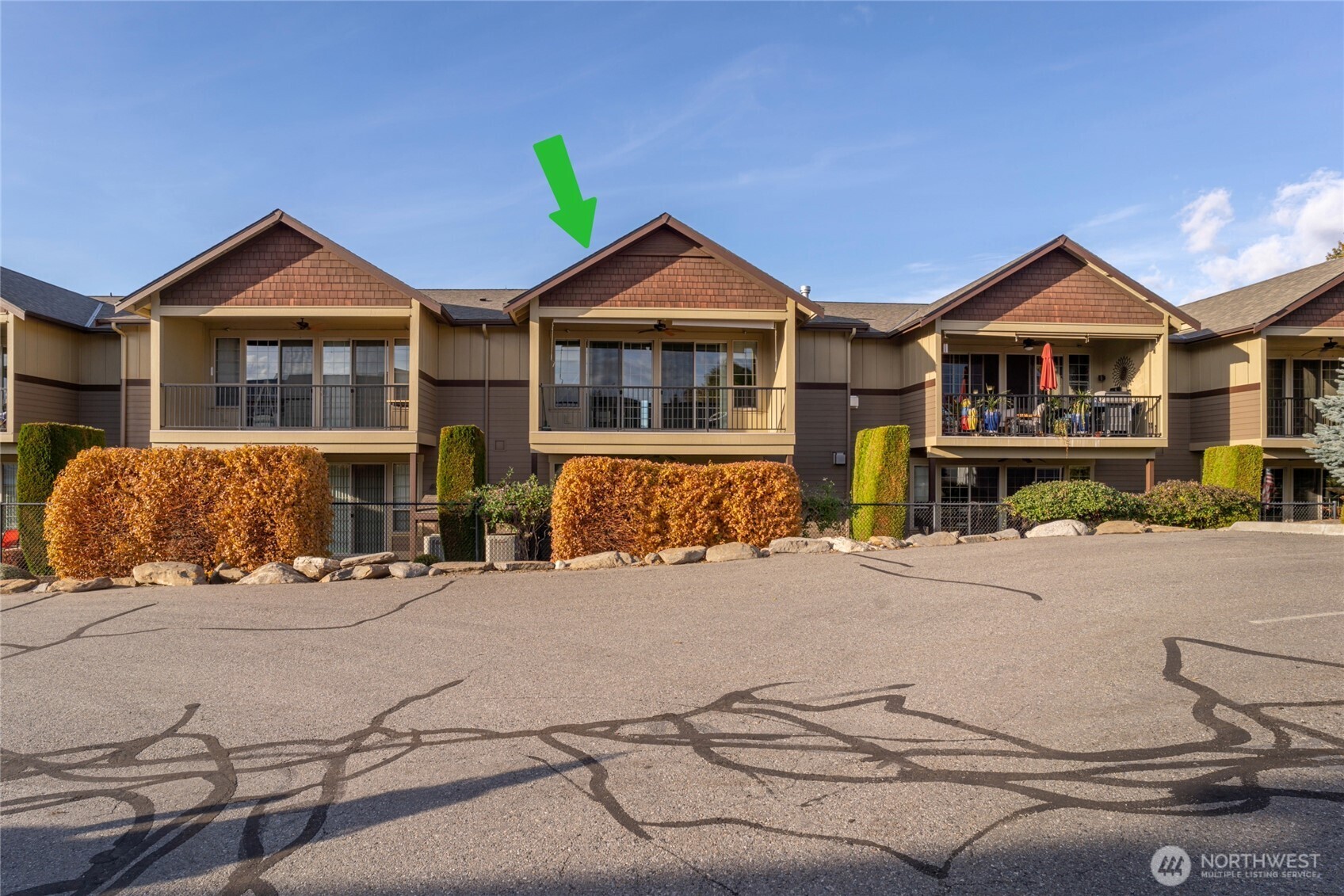 1051 North Baker Avenue, Unit B203 East Wenatchee, WA 98802 - Photo 5 of 33 a front view of a house with yard