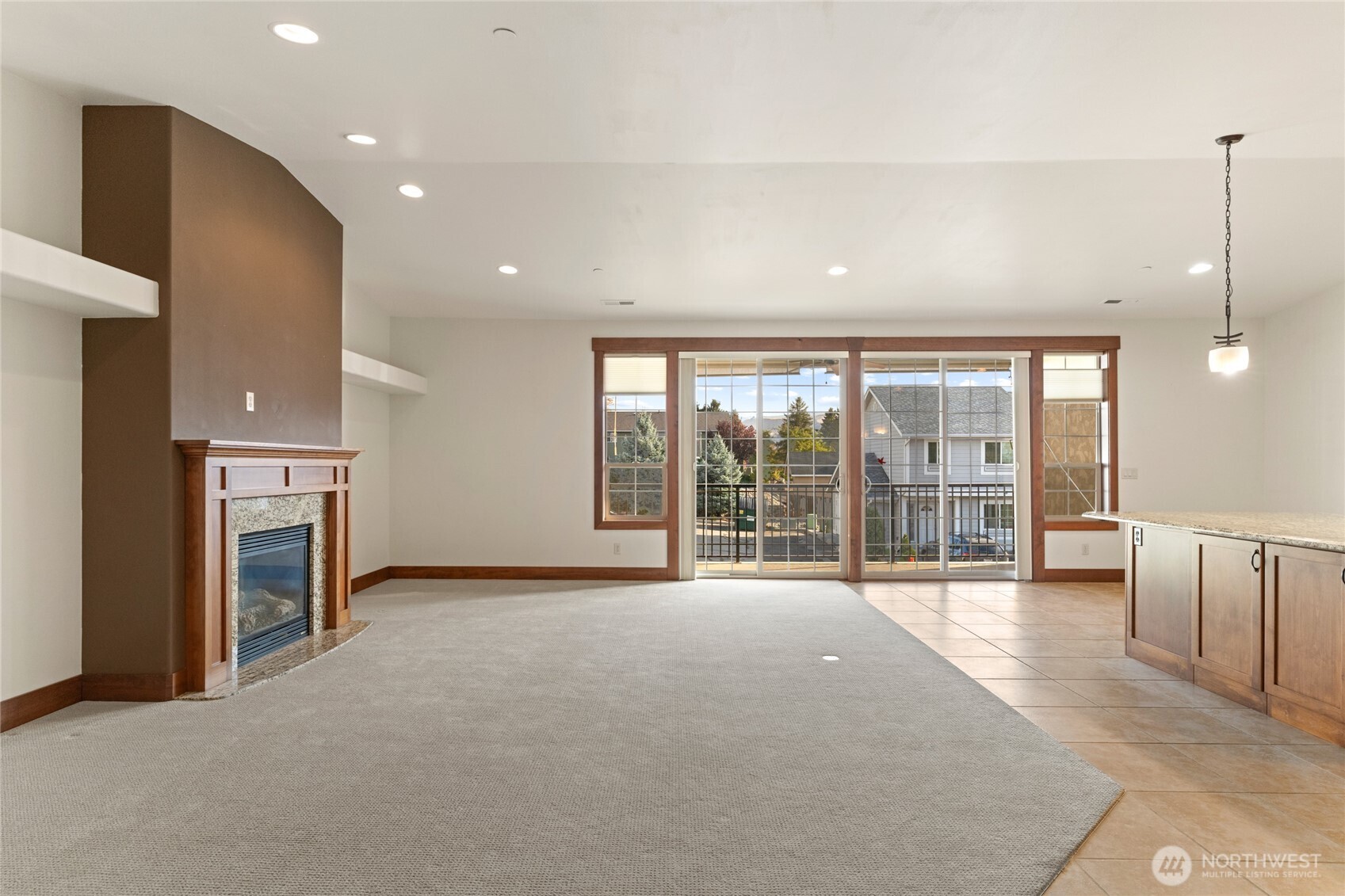 1051 North Baker Avenue, Unit B203 East Wenatchee, WA 98802 - Photo 7 of 33 a view of an empty room with a fireplace