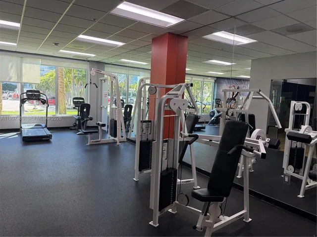 a view of a dining room with furniture and window