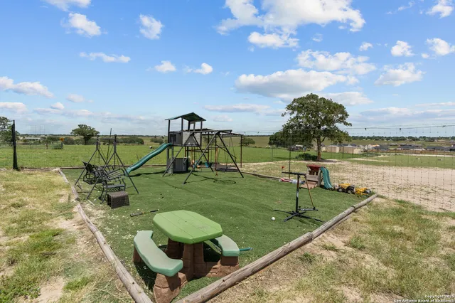 a view of a lake with a yard