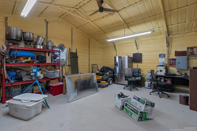 a living room with lots of furniture and a chandelier