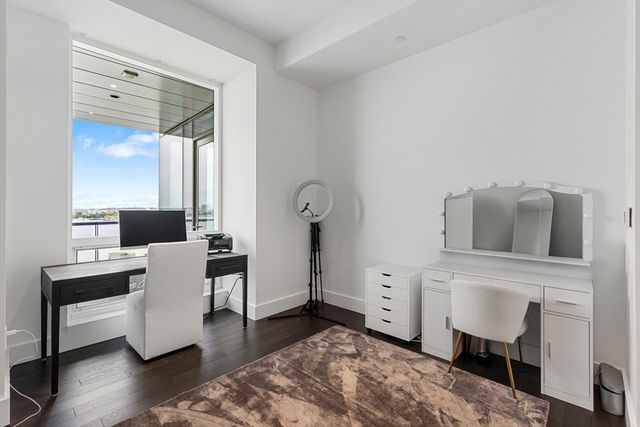a bathroom with a granite countertop sink toilet a shower and a mirror