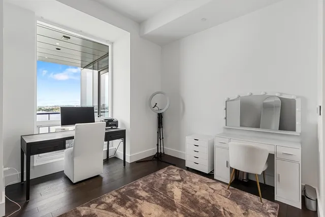 a bathroom with a granite countertop sink toilet a shower and a mirror