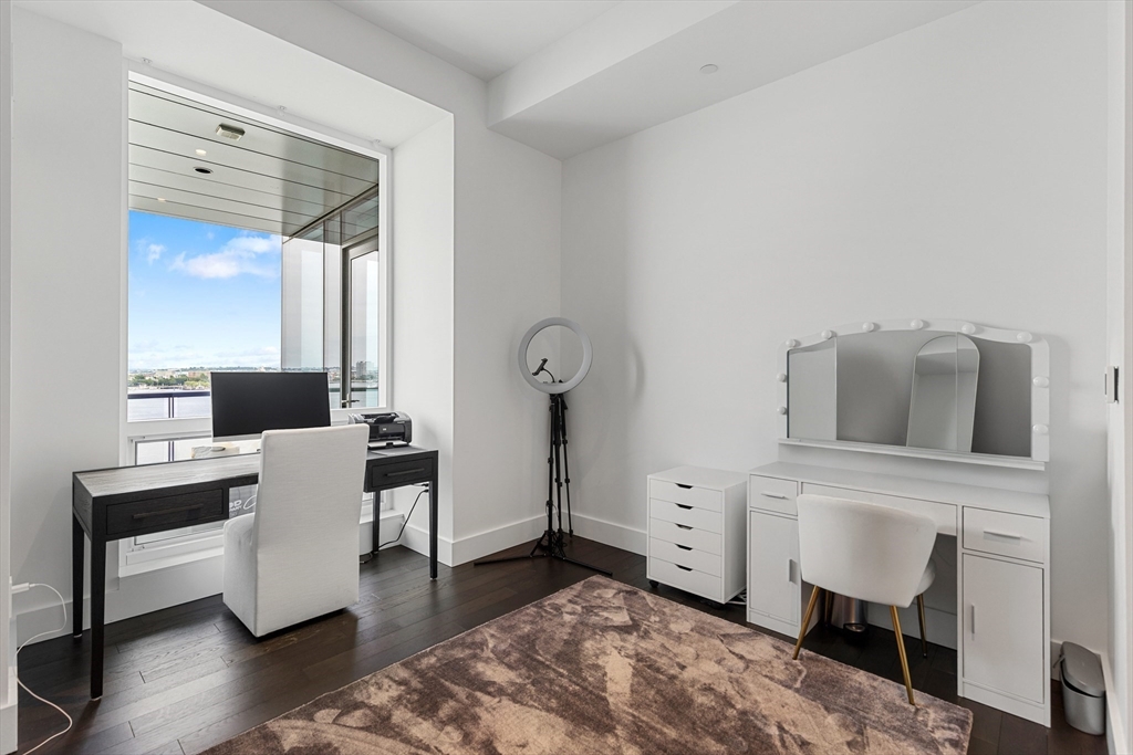 22 Liberty Drive, Unit 10D Boston, MA 02210 - Photo 18 of 26 a living room with furniture and wooden floor