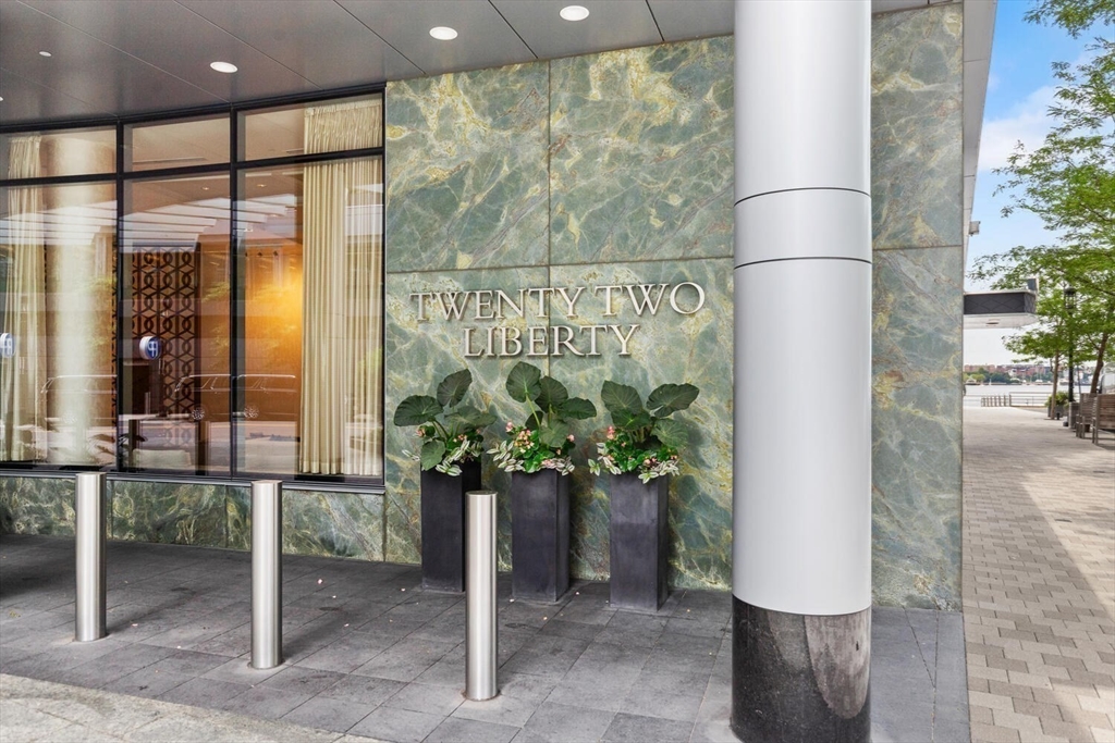 22 Liberty Drive, Unit 10D Boston, MA 02210 - Photo 24 of 26 a potted plant sitting in front of a glass door