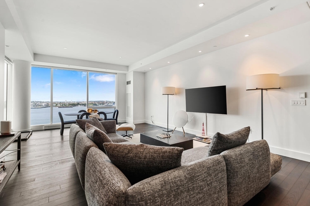 22 Liberty Drive, Unit 10D Boston, MA 02210 - Photo 6 of 26 a living room with furniture and a flat screen tv