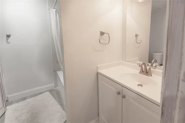 a bathroom with a sink and mirror
