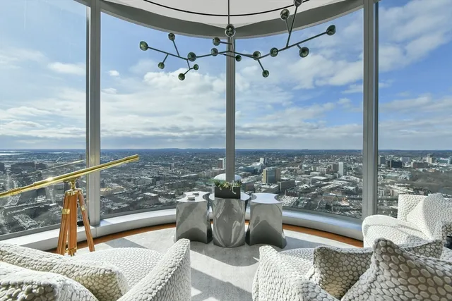 a view of a balcony with furniture