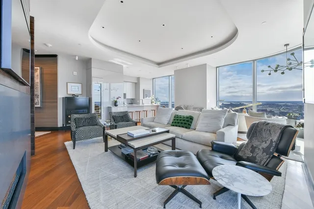 a living room with furniture and a rug