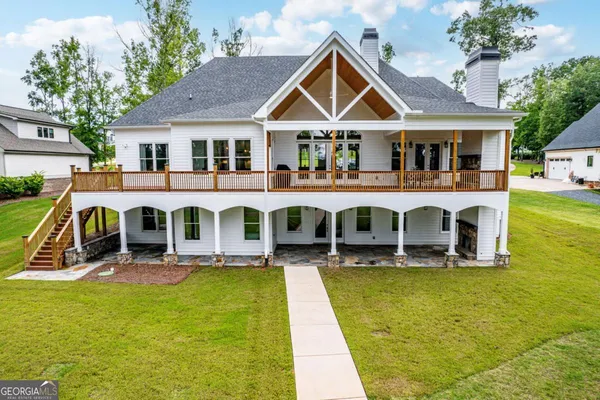a front view of house that has swimming pool