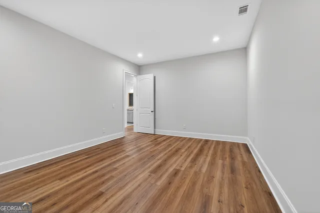 a view of a lake with houses in the back