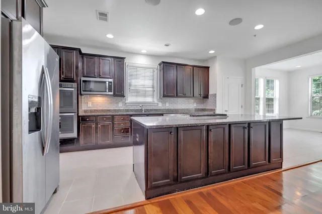 an empty room with furniture and a window