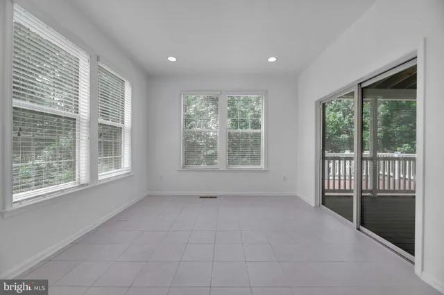 a bathroom with a sink a light fixture and a mirror