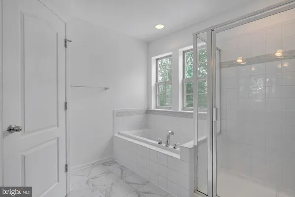 a bathroom with a sink toilet and a mirror