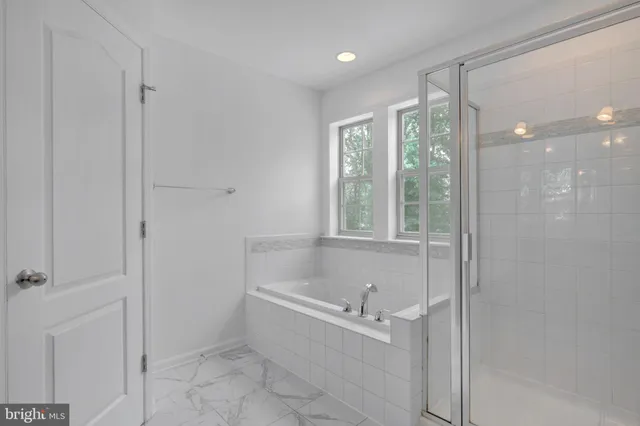 a bathroom with a sink toilet and a mirror