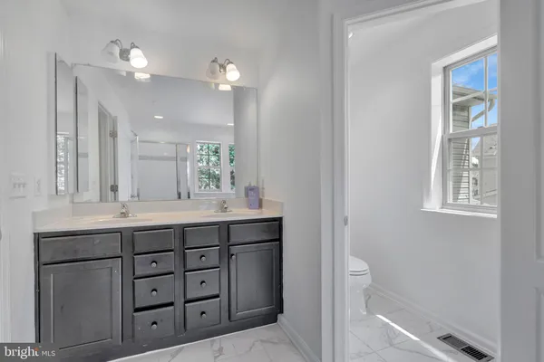 a view of a bathroom from a hallway