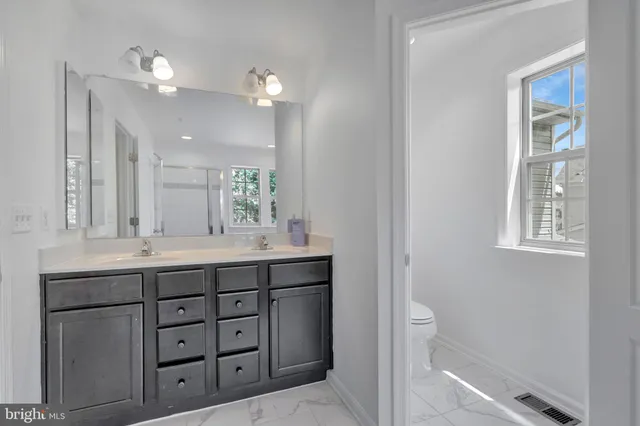 a view of a bathroom from a hallway