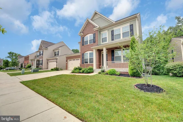 a bedroom with a bed and a potted plant