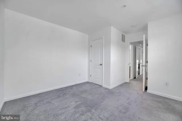 a kitchen with granite countertop a sink and a stove top oven