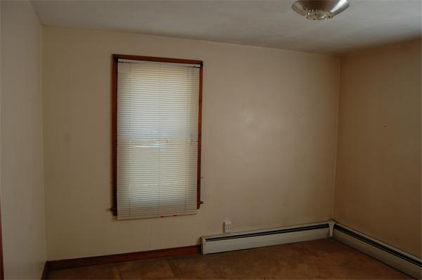12 Coache Street Three Rivers, MA 01080 - Photo 6 of 9 an empty room with a door