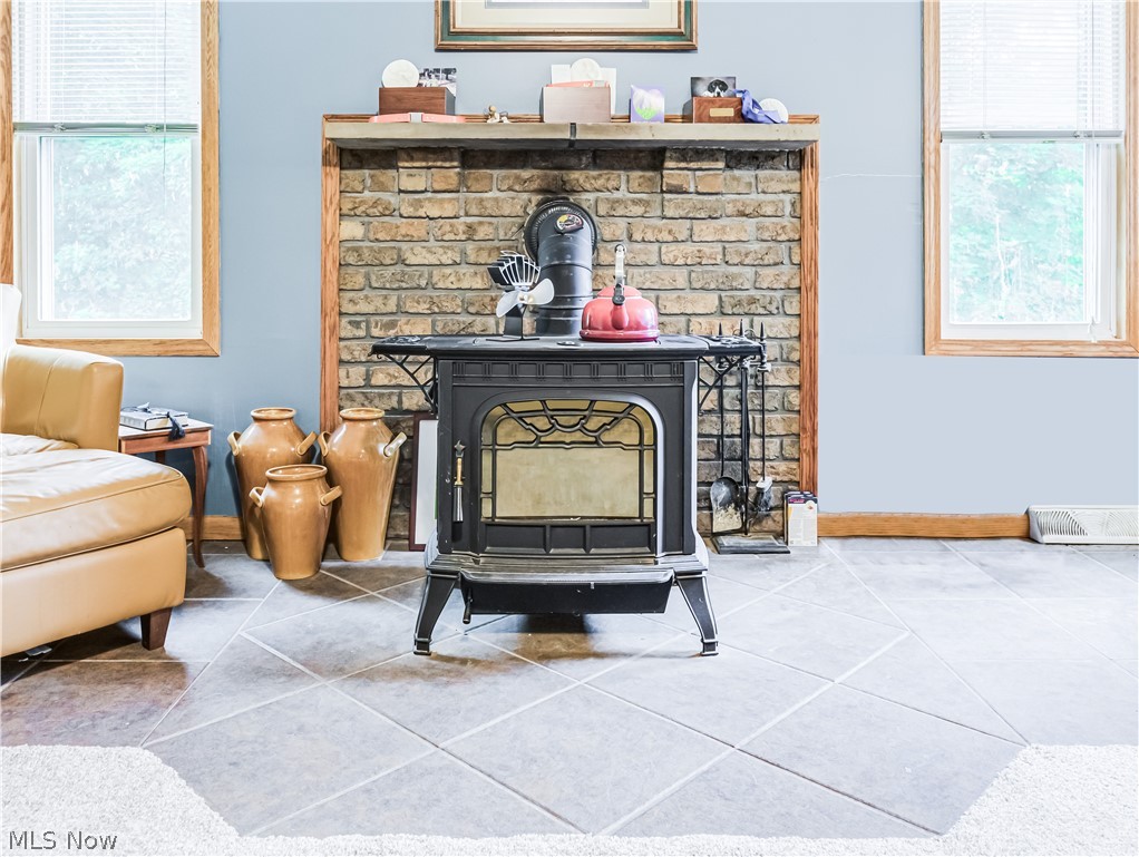 2700 Old Forge Road Kent, OH 44240 - Photo 8 of 34 Room details featuring tile flooring and a wood stove