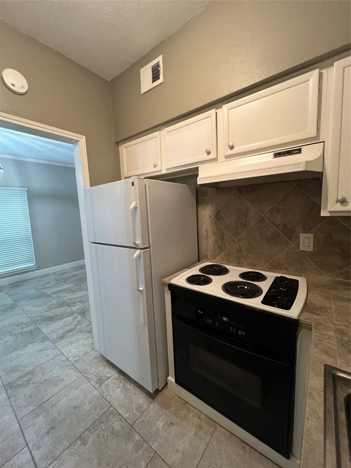 2100 Tanglewilde Street, Unit 455 Houston, TX 77063 - Photo 16 of 37 The full-sized refrigerator stays with the home!