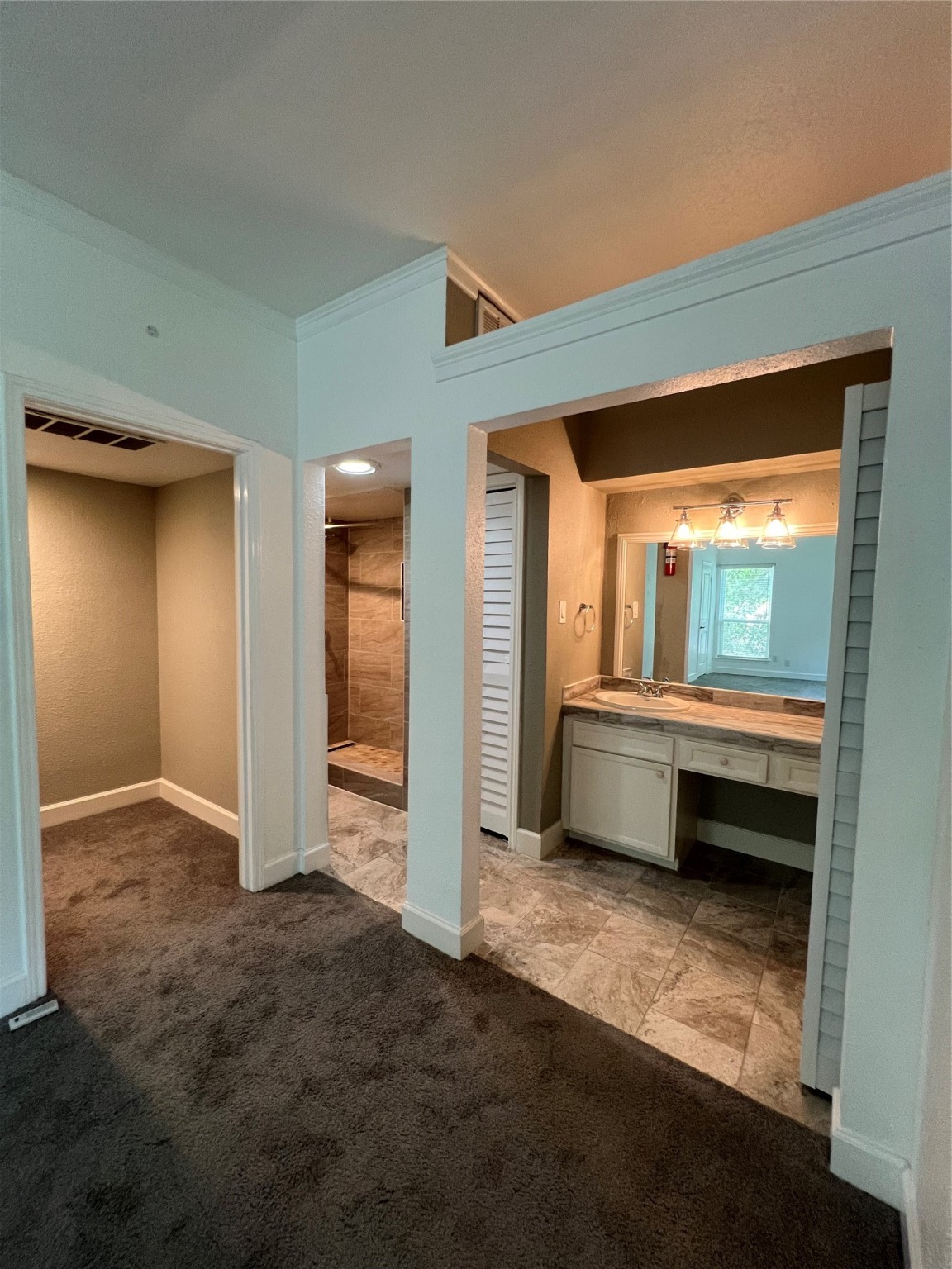 2100 Tanglewilde Street, Unit 455 Houston, TX 77063 - Photo 25 of 37 The vanity has a large mirror and knee space, so you can sit and gather your thoughts before heading out for the day!