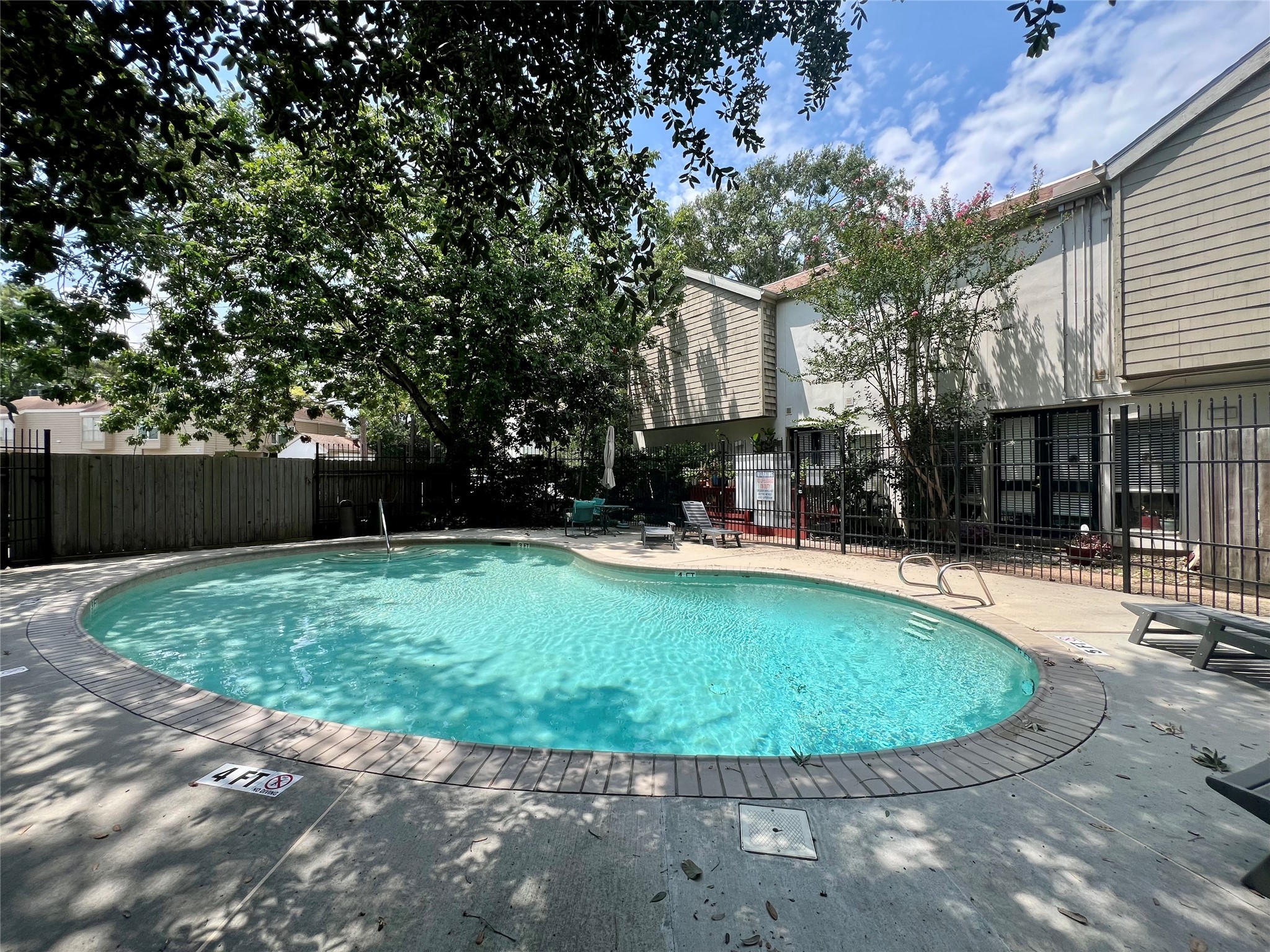 2100 Tanglewilde Street, Unit 455 Houston, TX 77063 - Photo 30 of 37 A sparkling pool awaits you to spend those hot summer days cooling down with your neighbors!