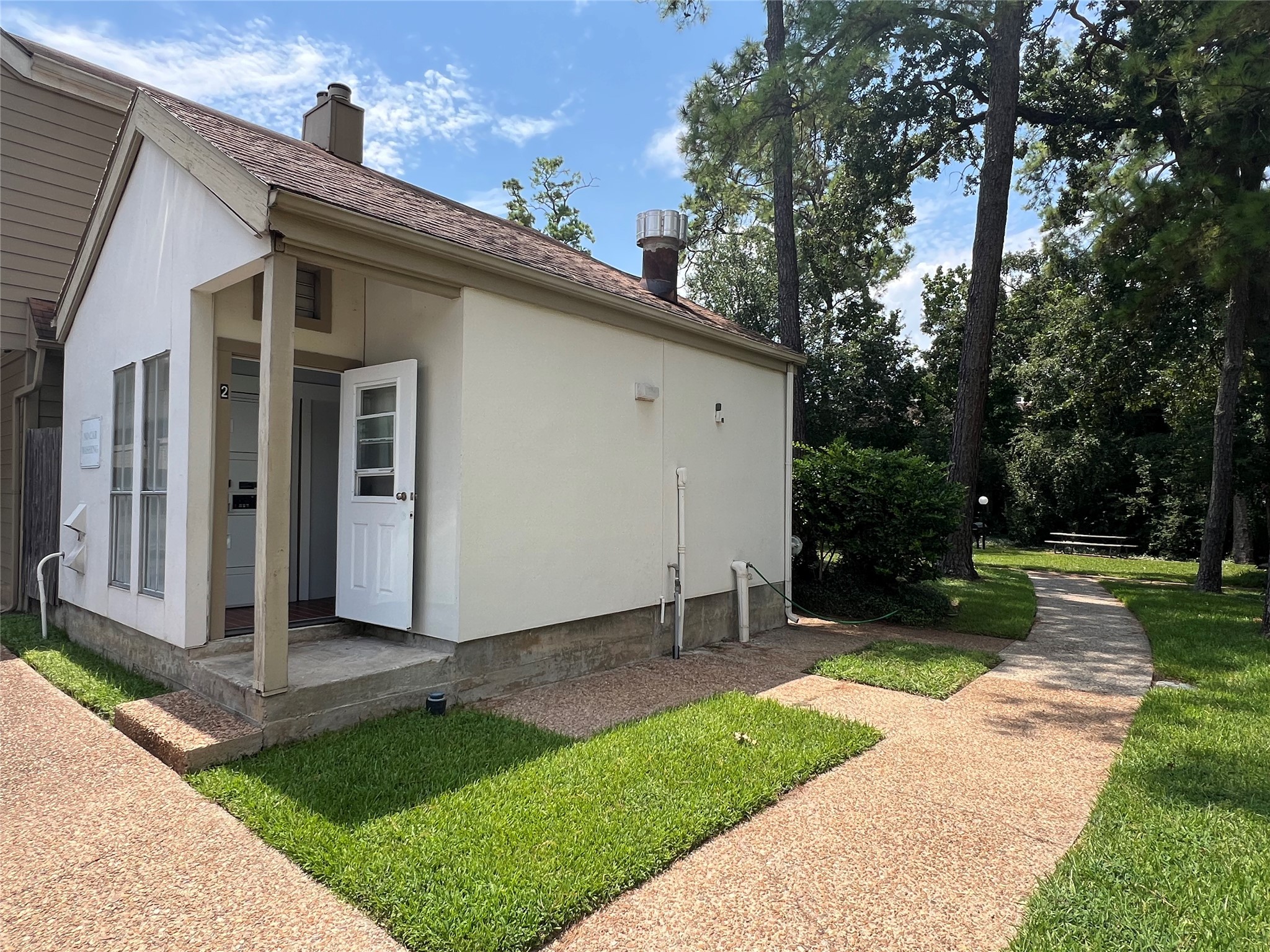 2100 Tanglewilde Street, Unit 455 Houston, TX 77063 - Photo 32 of 37 The cutest cottage serves as the complex laundromat!