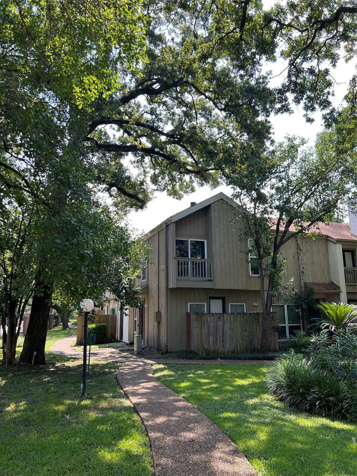 2100 Tanglewilde Street, Unit 455 Houston, TX 77063 - Photo 4 of 37 A peaceful pathway leads to this condo unit!