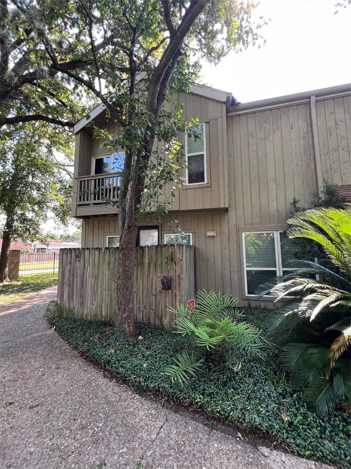 2100 Tanglewilde Street, Unit 455 Houston, TX 77063 - Photo 5 of 37 This property boasts two outdoor areas! This one has a view of the trees!