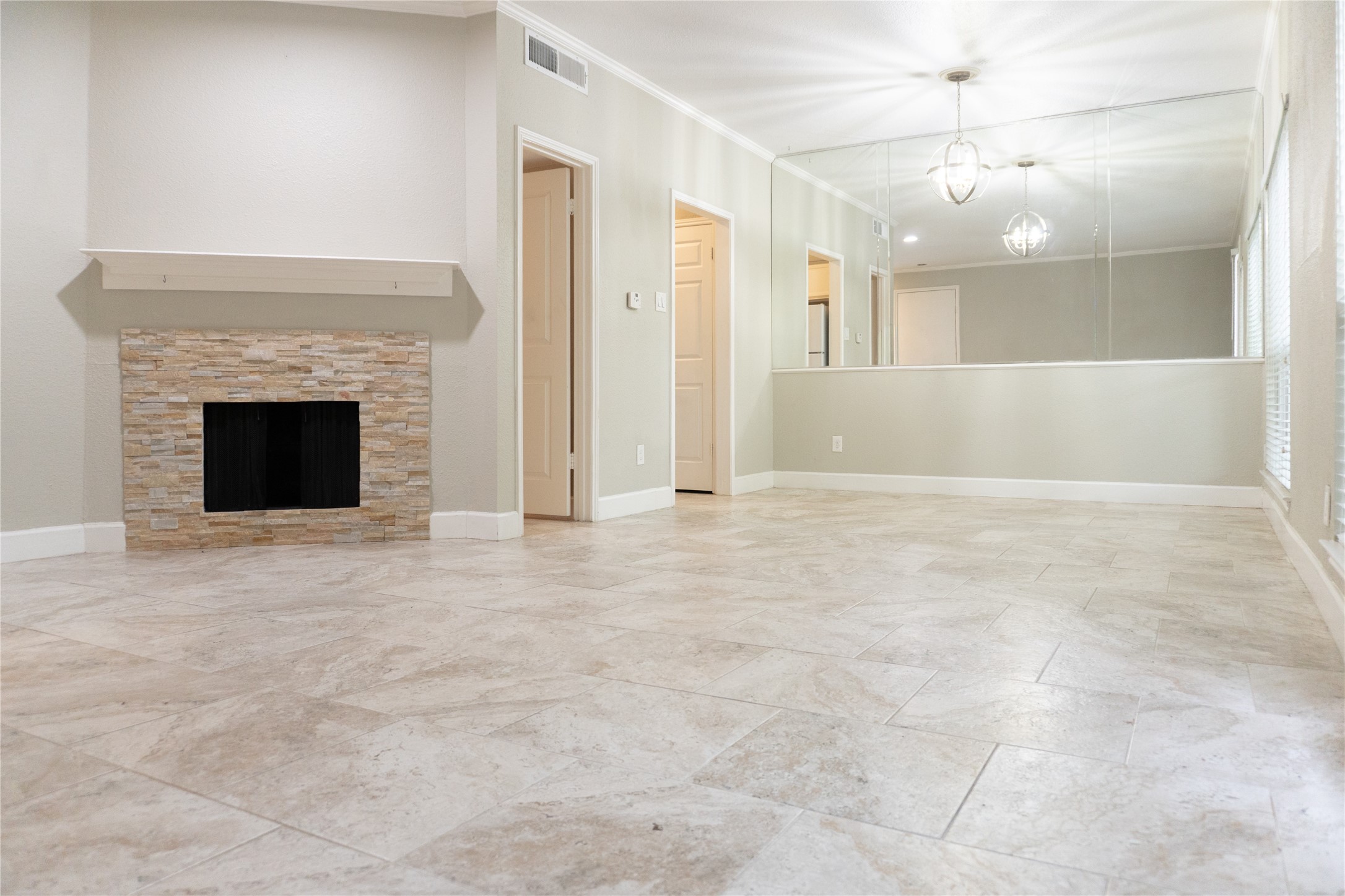 2100 Tanglewilde Street, Unit 455 Houston, TX 77063 - Photo 36 of 37 Open the door to an open floor plan with gorgeous tile flooring that flows throughout the downstairs spaces creating a seamless look!