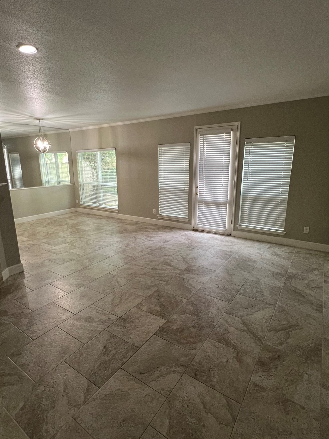 2100 Tanglewilde Street, Unit 455 Houston, TX 77063 - Photo 8 of 37 A large family room with adjacent dining area beckons for a gathering! A french door leads to the outdoor space!