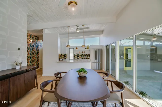 a kitchen with stainless steel appliances granite countertop a sink and a stove