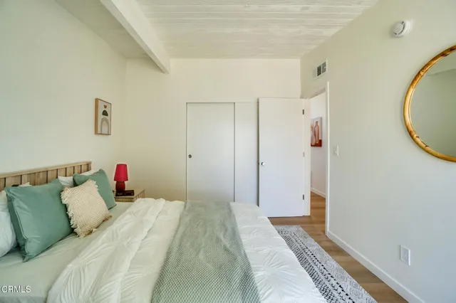 a bathroom with a sink mirror and a shower