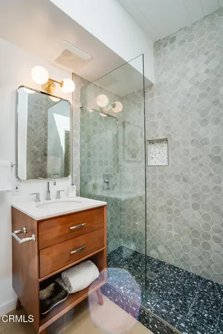 a bathroom with a sink and a mirror