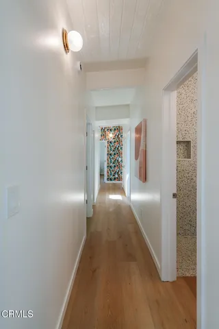 a bathroom with a sink a mirror and shower