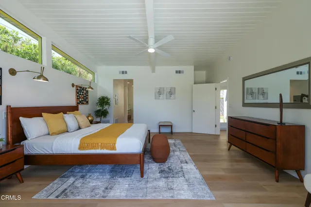 a view of a house with backyard patio and swimming pool